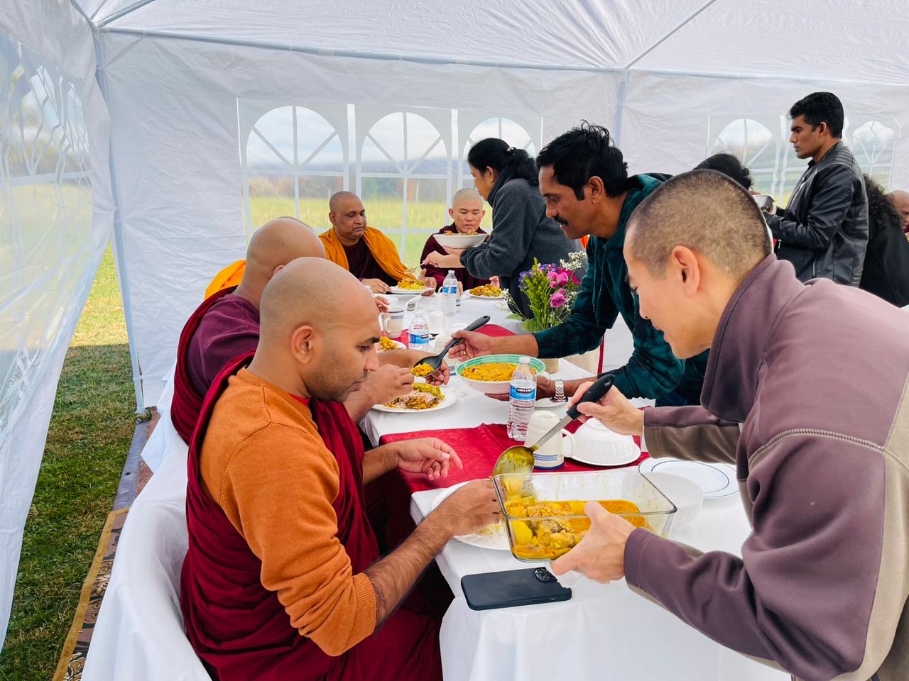 Bhante receiving dana meal